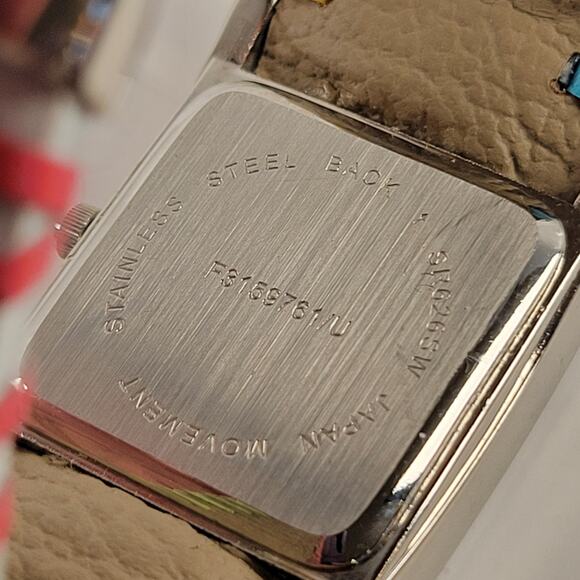 Silver Quartz Watch with Embossed Cuff White Leather Strap and Multicolor Design - Picture 15 of 16